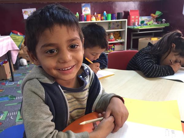 Smiling child at school in Tinca